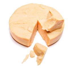 Whole round Head and pieces of parmesan or parmigiano