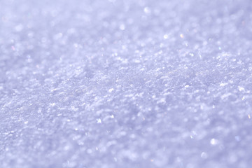 The texture of the snow is blue. Background for a New Year greeting card with sparkles.