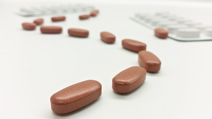 Brown tablets in the pharmacy laboratory