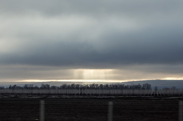 The golden sunlight through the heavy cloud before the storm coming