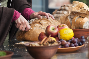 Cutting bread on a wooden Board