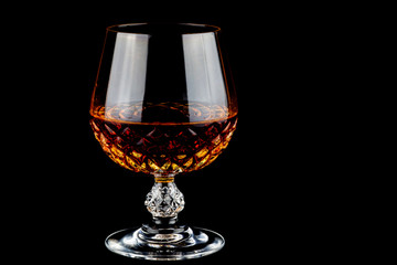 Brandy in a Crystal Glass on a Black Background
