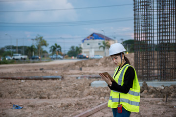 Fototapeta na wymiar Engineer woman working at site of bridge under construction