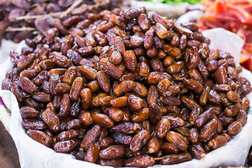 Fresh dates in a market - healthy lifestyle, food and fruit concept