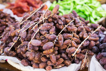 Fresh dates in a market - healthy lifestyle, food and fruit concept