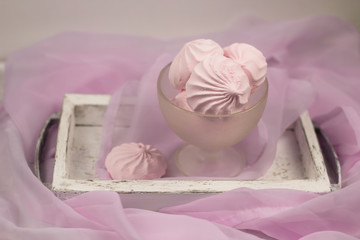 berry marshmallow in a vase on a table with a pink cloth