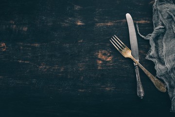 Old cutlery. Top view On a wooden background, Copy space.