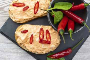 Homemade Toast sandwich with chili jam on white slate board. healthy food