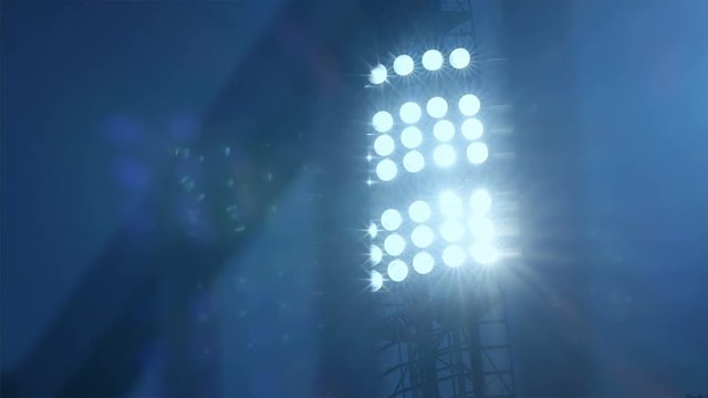 Background of football/soccer/sports stadium lights agains dark sky, 4k