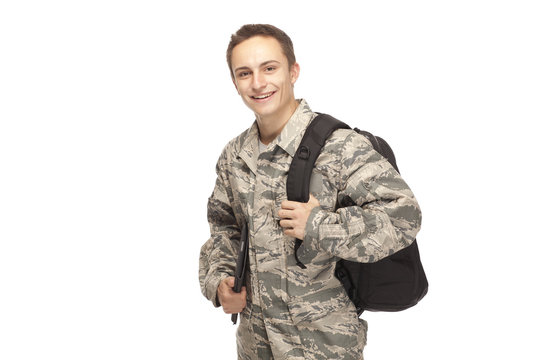 Portrait of air force airman with shoulder bag and digital tablet
