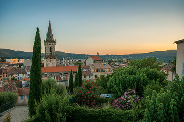 View of the graceful town of Draguignan from the hill of the clock tower under the colorful light of the sunset. Located in the Provence region, Var department, southeastern France