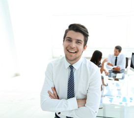 successful businessman on background of office.