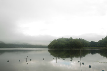 Landscape of Mountain on  Reservoir Tha Thung Na under cloudy on morning at Kanchanaburi Province of Thailand.
