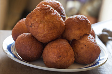 hot whole homemade round fried donuts with poppy close
