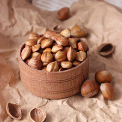 Peeled hazelnuts on the background of wood. useful snack, proper nutrition. how to peel the nuts.