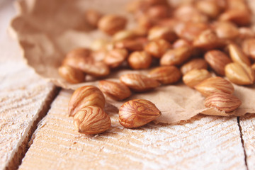 Peeled hazelnuts on the background of wood. useful snack, proper nutrition. how to peel the nuts.
