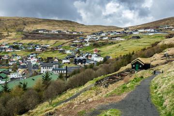 Naklejka premium Vestmanna, Faroe Islands, Denmark, in North Atlantic. Beautiful landscape. The city in the mountains. Springtime, 04.2018.
