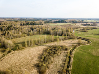 drone image. aerial view of rural area with wawy river ion forests