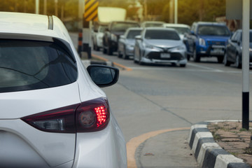 Cars on the road heading towards the goal of the trip and stop by traffic jam with open break of car.