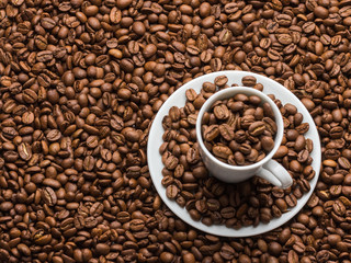 The coffee cup and saucer are filled with coffee grains