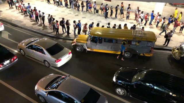 People waiting jeepny at the Makati city, Manila, Philippines
