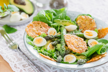 Fototapeta na wymiar Asparagus Salad with quails eggs and cheese crisps