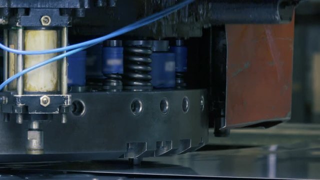 Coordinate punching press CNC machine works at the factory