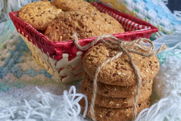 Savory cookies sprinkled with sesame seeds, sunflower on textile plaid