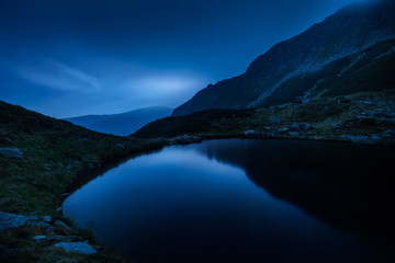 Fototapeta na wymiar Mountain lake landscape at night