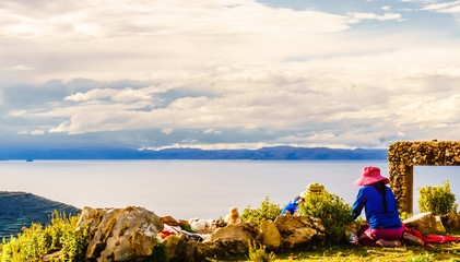 View on Indigenous woman on isla del sol by lake titicaca - Bolivia