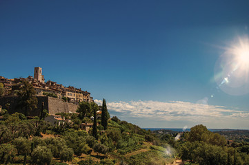 Fototapeta na wymiar Panoramic view of the Saint-Paul-de-Vence village on top of hill, a lovely well preserved medieval hamlet near Nice. Alpes-Maritimes department, Provence region, southeastern France. Retouched photo