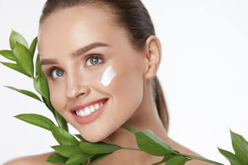 Beauty Face Care. Woman With Cream On Facial Skin