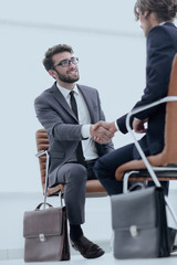 wo focused coworkers sitting together in a modern office