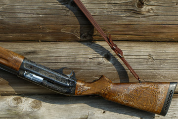 A beautiful gun decorated with carvings.