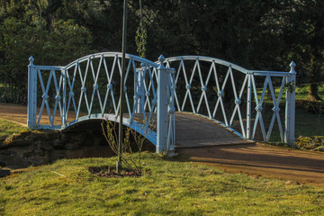 Small footpath bridge crossing a water stream