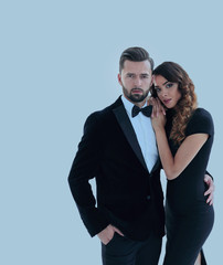 portrait of an elegant woman in a black dress hugging her lover