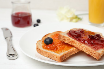 Toasts with jam on plate, closeup