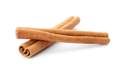 Aromatic cinnamon sticks on white background