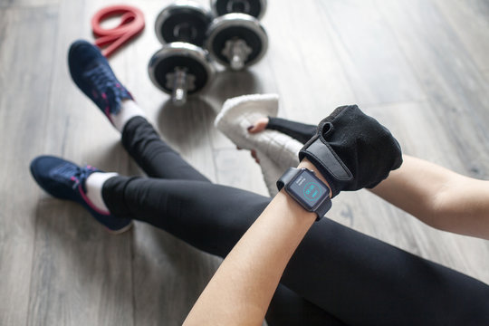 girl launches fitness app on smart watch.