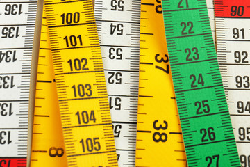 Different measuring tapes, closeup
