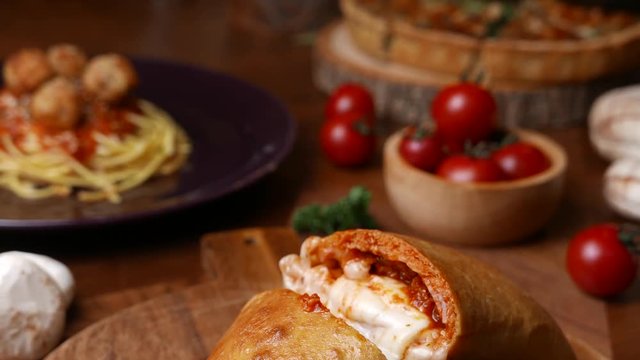 baked pizza puff set on dinner table.