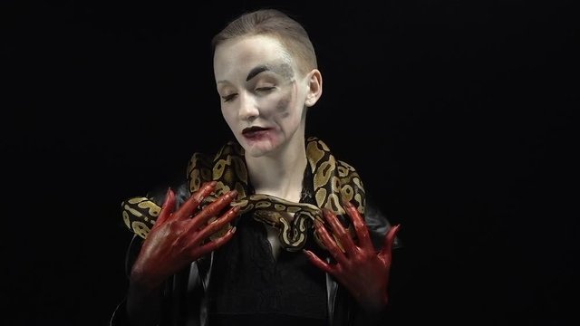 Woman in image with two snakes
