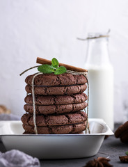 baked round cookies tied with a rope in an iron plate