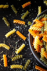 Italian macaroni on clay Bowl. Italian Pasta without cooking. Colored Pasta. Mediterranean diet.