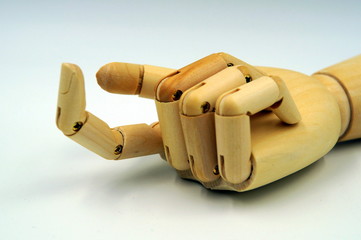 Wooden artificial hand making a index finger crooked reckoning 
