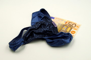 Prostitution concept: lingerie and money, 50 Euro banknote.