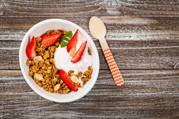Strawberry Cinnamon Granola Yogurt Breakfast. Selective focus.