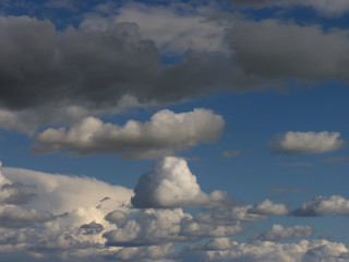Background with white and gray clouds in a blue sky