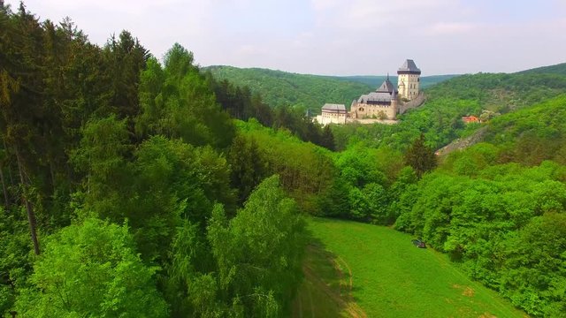 Camera flight around The Karlstejn castle. Royal palace founded King Charles IV. Amazing gothic monument in Czech Republic, Europe. 