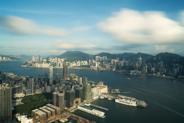 Fototapeta na wymiar Aerial view of Hong Kong skyline and Victoria Harbor with blue sky in Hong Kong. Asia..